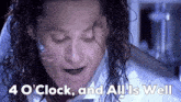 a close up of a man 's face with the words 4 o clock and all is well below it