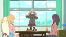a girl stands on a table in front of a window with a bottle that says ' coca cola ' on it