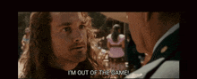 a man with long hair says i 'm out of the game while talking to another man