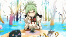 a girl with green hair sits at a table with a cup of tea