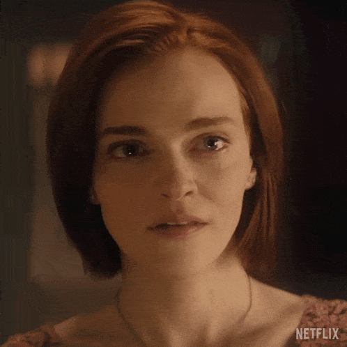 a close up of a woman 's face with a netflix logo on the bottom
