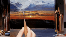 a person is painting a sunset on a canvas with the words made in animatica on the bottom