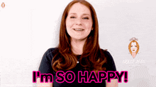 a woman with red hair says i 'm so happy in pink letters