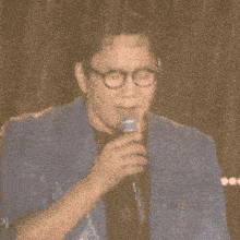 a man singing into a microphone with the words royal family on the bottom