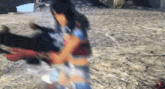 a blurred image of a woman standing on a rocky hill