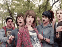 a group of people are standing next to each other .