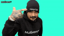 a man wearing a black hoodie and a black beanie with the word portal on it