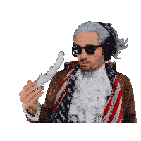 a man wearing a wig and headphones is holding a white object