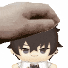 a hand is petting a doll 's head .