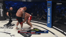 two men are fighting in a boxing ring and the time of the fight is 03:44