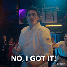 a man in a karate uniform is saying no i got it