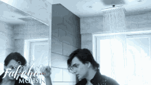 a picture of a man taking a shower with the name mohsin on the bottom right
