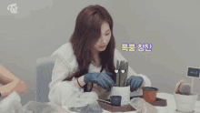 three women are sitting at a table with a sign that says ' twice ' on it