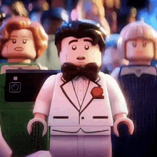 a lego man is wearing a tuxedo and bow tie