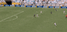 a soccer player with the number 12 on his shirt is talking to another player .