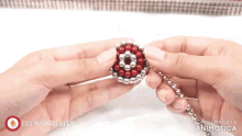 a person is holding a red and silver ball with the words diy wonderful written on the bottom