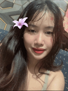a young woman with a flower in her hair