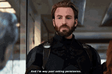 a man with a beard is talking to another man in a suit .