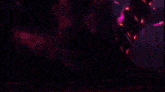 a close up of a red and purple background with a dark background