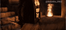 a woman is being hit by a beam of light with the hashtag avantika_0902 on the bottom
