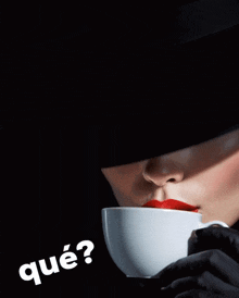 a woman with red lips is holding a cup of coffee and the question que is above her head