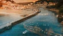 an aerial view of a harbor with a boat in the water and the name matt carter at the bottom