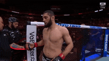 a man in a boxing ring with a sign that says bud light