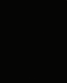 a dark background with a reflection of a moon in the water