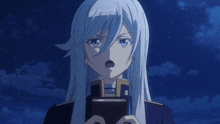 a girl with long white hair holds a book in her hands