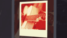a picture of a person playing a guitar with a red background