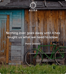 a bicycle is parked in front of a wooden building with a quote by pema chodron