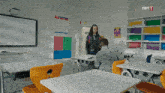 a classroom with a trt 1 logo on the bottom