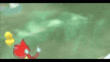 a yellow rubber duck is swimming next to a red object