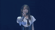 a woman in a white shirt and tie is dancing