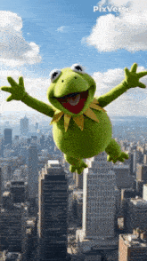 kermit the frog is flying through the air with his arms outstretched