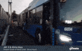 a blue bus with the number 604 on the front
