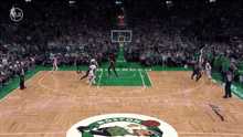a boston celtics basketball game is being played in front of a large crowd
