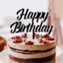 a close up of a birthday cake with a happy birthday cake topper .
