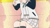 a girl is sitting on a couch holding a controller