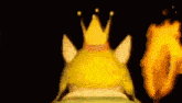 a frog with a crown on his head is holding a torch in a dark tunnel .