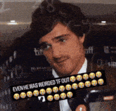 a man in a suit and tie with a sign that says " even he was weirded tf out " on it