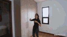 a woman is standing in a room with the words made in animotica on the bottom right