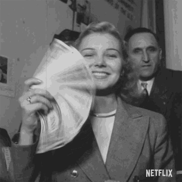 woman with a fan made of money