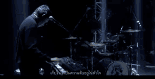 a group of people are playing instruments on a stage with a triangle in the middle