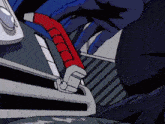 a close up of a person 's hand holding a red object