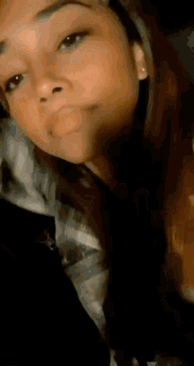 a close up of a woman 's face with long hair