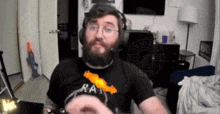 a man wearing a black shirt that says rat