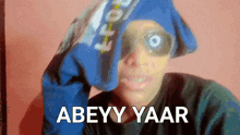 a person wearing a blue hat and sunglasses says abey yaar