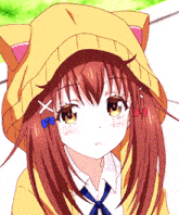 a close up of a girl wearing a cat hoodie