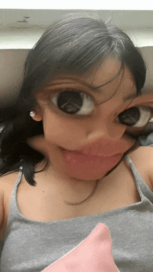 a girl making a face with her eyes closed